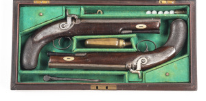 CASED BRACE OF PERCUSSION COACH PISTOLS: .50 Cal: 9¼" octagonal barrels with Birmingham proofs; acanthus foliate engraved back action locks, one hammer a possible replacement; mottled brown/grey patina to barrels & actions; g. cond stocks with chequered 