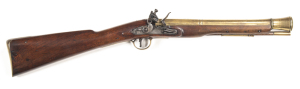 ENGLISH BRASS BARREL FLINTLOCK BLUNDERBUSS by E. BAKER: 11/8" at muzzle; 14" round to octagonal brass barrel, inscribed LONDON; bevel edged stepped lock with bolted safety, border engraved & inscribed E. Baker, fitted with a ring neck cock & semi w/proof 