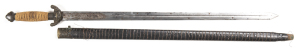 CHINESE SWORD: f to g 29½" straight double edged blade with central fullers decorated with 7 round brass studs to each side; ricasso relief engraved with a dragon to both sides; brass cross guard & pommel of traditional form with a dark patina; grip bound