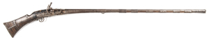 NATIVE MOROCCAN SNAPHAUNCE GUN: 38 bore; 45" round to octagonal 3 stage barrel with flared muzzle; lock with sliding pan cover, action a/f; f. cond full stock with 8 iron barrel bands, butt framed in iron with some decorative elements, scorch mark to lock