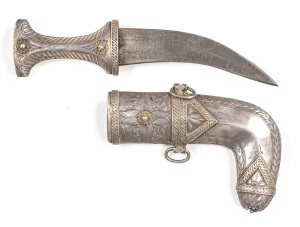 OMANI SILVER MOUNTED JAMBIYA: 6" curved double edged blade with v. light staining; ornate silver hilt with Islamic script & filigree work; silver mounted scabbard with foliage panels; vg cond. Jambiya is only 9" o/a; possibly for a boy. C.1860 