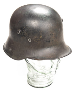 GERMAN WW1 MODEL 16 OR'S STEEL FIELD HELMET: complete with leather liner & chin strap; worn military finish to a pleasing patina; one sweat band stud missing; o/all g. cond.