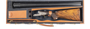 CASED BERETTA 451 EELL SIDELOCK SxS S.S.T. SHOTGUN: 12G; 28" barrels; exc bore; choked MOD & FULL, 2¾" chambers; tapered concaved rib; beautiful foliate engraved action with gold trigger & side lock pins; top lever with gold crown; tang with manual safet