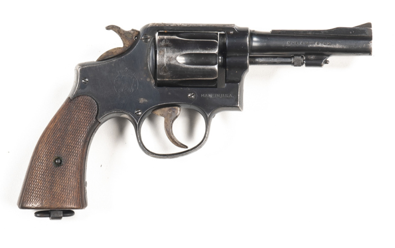 SMITH & WESSON VICTORY MODEL CONVERTED TO A TARGET HAND GUN: 38 S&W; 6 shot fluted cylinder; 102mm (4") barrel with Parker Hale ramp front sight; SMITH & WESSON to lhs of barrel’, 38 S&W CTG to rhs; English proofs to frame, barrel & cylinder; g. profiles