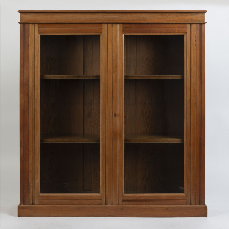 A free standing Australian two door bookcase, walnut and red pine, circa 1900, ​130cm high, 119cm wide, 32cm deep