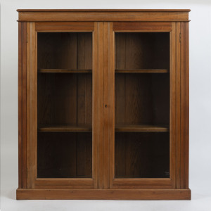 A free standing Australian two door bookcase, walnut and red pine, circa 1900, 130cm high, 119cm wide, 32cm deep