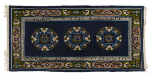 A Chinese hand-woven rug with three medallions on blue background, 20th century, 190 x 90cm