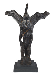 Winged spirit figure, carved wood, shell, fibre and earth pigments, Papua New Guinea, mid 20th century, mounted on later wooden plinth, ​94cm high, 104cm high overall