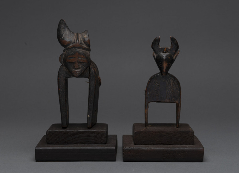 Two African weaving pulleys, carved wood, Baule tribe, Ivory Coast, on later wooden plinths (both loose), 14cm high overall