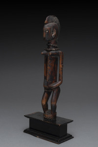 A standing female figure, carved wood, metal seeds and fibre, Bambara tribe, Mali, on later wooden plinth, 31cm high
