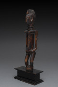 A standing female figure, carved wood, metal seeds and fibre, Bambara tribe, Mali, on later wooden plinth, ​31cm high