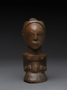 An African female fetish figure, carved wood, Basongye tribe, Southern Congo, 14.5cm high.