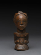An African female fetish figure, carved wood, Basongye tribe, Southern Congo, 14.5cm high.