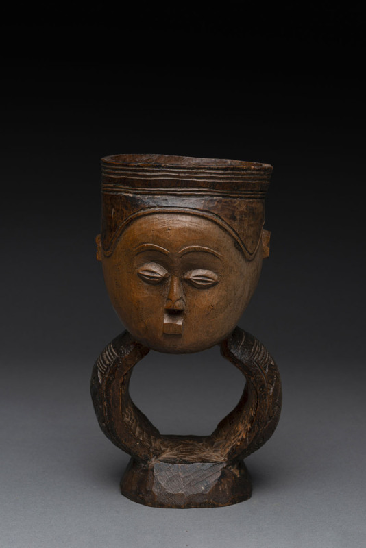 An African ceremonial face cup, carved wood, Bakuba tribe, Central Congo, 20.5cm high