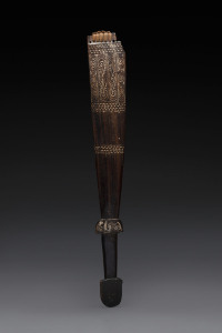 A sword club, carved wood, piped clay and fibre, Milne Bay area, Papua New Guinea, ​62cm long