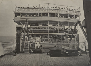 THE PENINSULAR & ORIENTAL COMPANY: A dilapidated presentation album, circa 1887, which contains 21 large format (27 x 37cm) photographic prints on Ilford Bromide paper. The images represent views of some of the newest P.&O. ships, their crews, public rooms, etc. The photo plates are laid down on thick card pages which are backed by lithographic prints of advertisements for comapnies and suppliers associated with the company: Twining & Coy., National Bank of Egypt, Hong Kong & Shanghai Bank, etc.