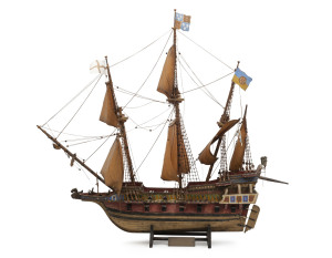 REVENGE scratch built model galleon with title plaque "Revenge, 1577, Sir Richard Grenville". 20th century, The Revenge built in 1577 had a colourful and illustrious career which included battling the Spanish Armada and later becoming Sir Francis Drake's flagship. She was eventually sunk by her own commander Sir Richard Grenville in 1591 after a long battle with the Spanish who numbered 53 ships to her one. 70cm high, 75cm long