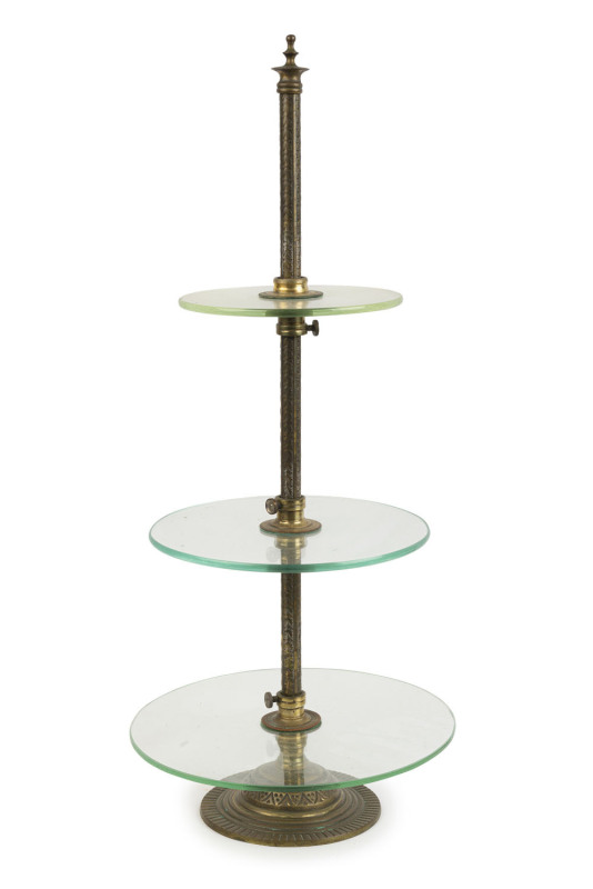 An antique three tier shop display stand gilt metal, brass and glass, 19th century, ​73cm high, 31cm diameter