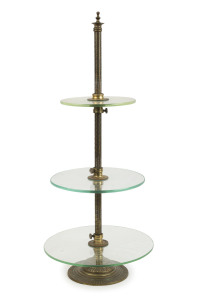An antique three tier shop display stand gilt metal, brass and glass, 19th century, 73cm high, 31cm diameter