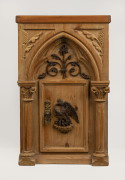 A Continental Gothic cabinet, carved Baltic pine with phoenix door, 19th century, later top, ​58cm high, 37cmwide, 32cm deep