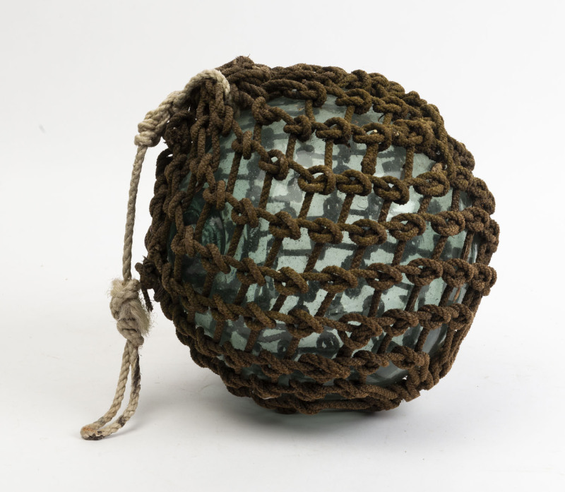 A vintage glass fishing buoy with rope binding, mid 20th century, 30cm  diameter