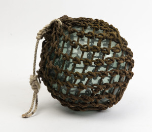 A vintage glass fishing buoy with rope binding, mid 20th century, 30cm diameter