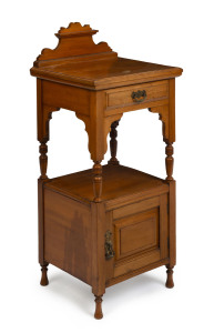 A late Victorian bedside cabinet, pine with red pine secondary timbers, late 19th century, with ivoreen plaque "POPHAN, RADFORD & Co. Complete House Furniture, PLYMOUTH", 98cm high, 42cm wide, 40cm deep