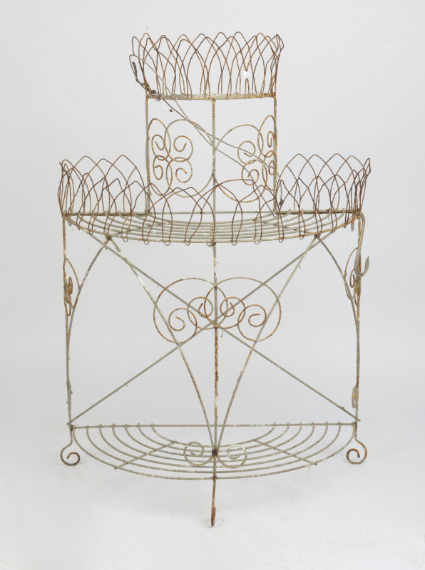 An antique wire work plant stand, circa 1910, ​116cm high, 77cm wide, 39cm deep