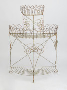 An antique wire work plant stand, circa 1910, ​116cm high, 77cm wide, 39cm deep