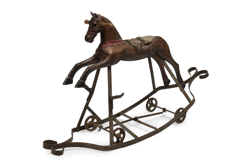 A rare antique pull-along rocking horse toy, carved wood and wrought iron, 19th century, ​66cm high, 108cm long