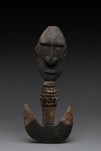 A food hook, carved wood with remains of piped clay, Papua New Guinea, ​41cm high