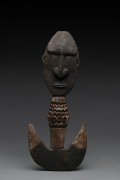 A food hook, carved wood with remains of piped clay, Papua New Guinea, ​41cm high