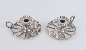 A pair of English Britannia metal candle holders (one with snuff), circa 1900, 7cm high, 18cm wide