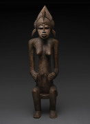 A seated female figure with pelican head dress, carved wood, Senufo tribe, Ivory Coast, ​87cm high