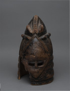 A Bundu mask, carved and patinated wood, Mendi tribe, Sierra Leone, ​42cm high