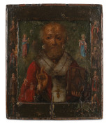 A Russian icon depicting Saint Nicholas the Wonderworker between the Virgin and Christ, with patron saints; hand-painted on wooden panel, 18th/19th century,31.5 x 26.5cm