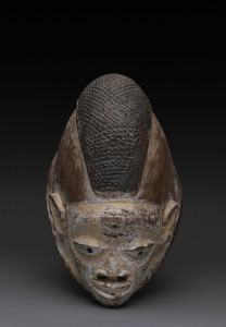 Gelede mask with ornate hair decoration, carved wood with remains white ochre, Yoruba tribe, Nigeria, 30cm high