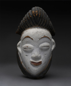 A death mask, carved wood with kaolin finish, Punu tribe, Gabon, 29cm high