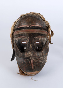 Poro mask, carved wood, fibre and monkey hide, Dan-Guere tribe, Ivory Coast, 28cm high