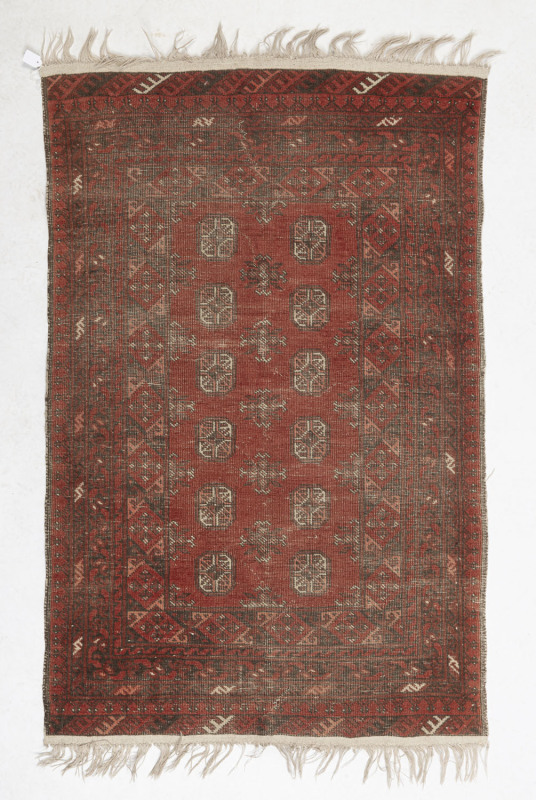 A red Turkoman rug (very worn), 130 x 81cm