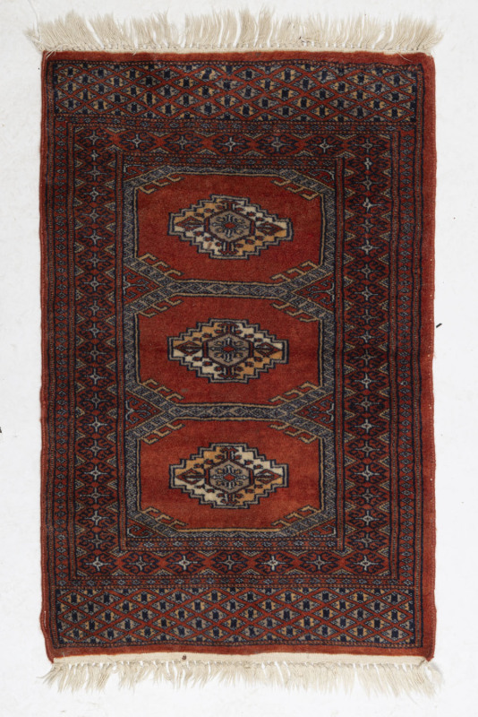 A small Turkoman hand-woven wool rug, ​100 x 61cm