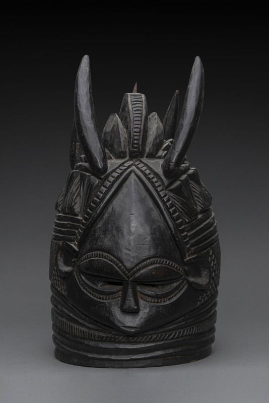 Bundu mask, triple crested with four horns, carved wood black finish, Mendi tribe, Sierra Leone, ​40cm high