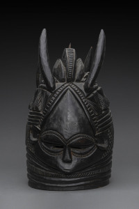 Bundu mask, triple crested with four horns, carved wood black finish, Mendi tribe, Sierra Leone, ​40cm high