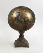 A glass globe with internal découpage decoration on cast metal base, ​45cm high