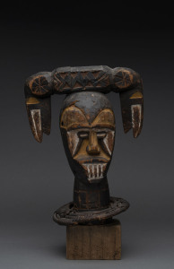 A double sided bust, carved wood and wicker with earth pigment, Ekoi tribe, Nigeria/Cameroon, on later wooden base, 33cm high overall