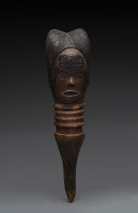 A figural architectural finial, carved wood with pokerwork highlights, Kuyu tribe, Gabon, 55cm high