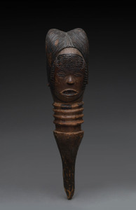 A figural architectural finial, carved wood with pokerwork highlights, Kuyu tribe, Gabon, ​55cm high