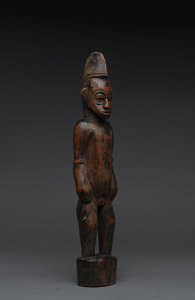 A male standing figure, carved wood with remains of red finish, Senufo tribe, Ivory Coast, 38cm high