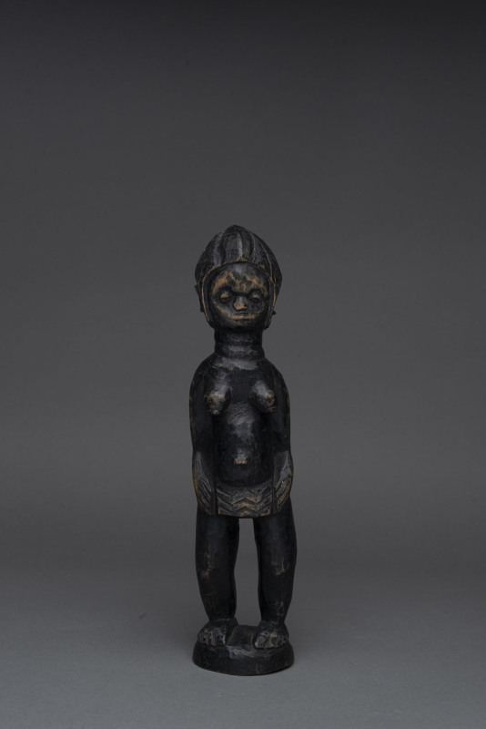 A standing female figure, carved wood with black finish, Mendi tribe, Sierra Leone, 32cm high