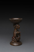 Kneeling female figure with divination bowl, carved wood with remains of polychrome finish, Yoruba tribe, Nigeria, ​20cm high